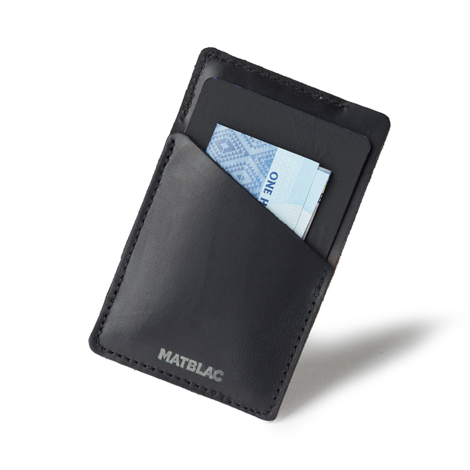 Black genuine leather quickdraw slim wallet on white background